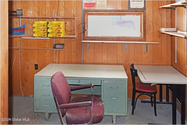 office with wood walls and concrete floors