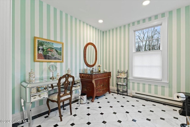 office space featuring a baseboard radiator and light tile floors