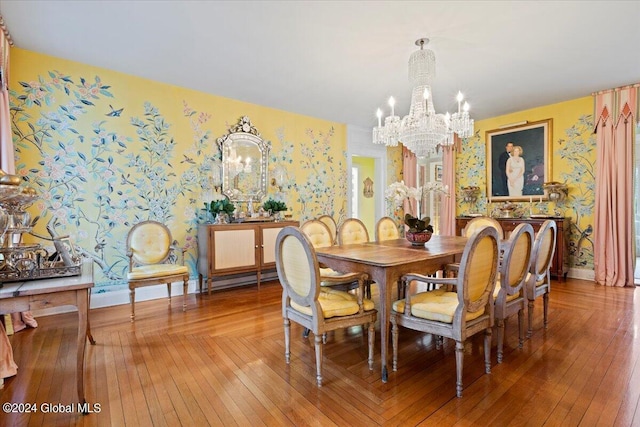 dining area with an inviting chandelier