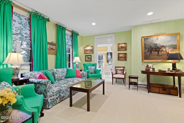 carpeted living room featuring plenty of natural light