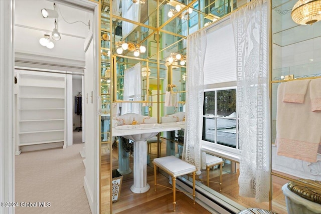 interior space with a notable chandelier and light wood-type flooring