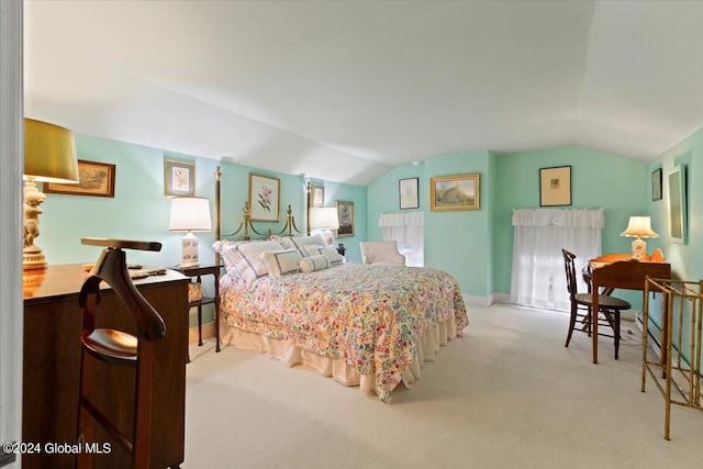 bedroom featuring lofted ceiling and light colored carpet