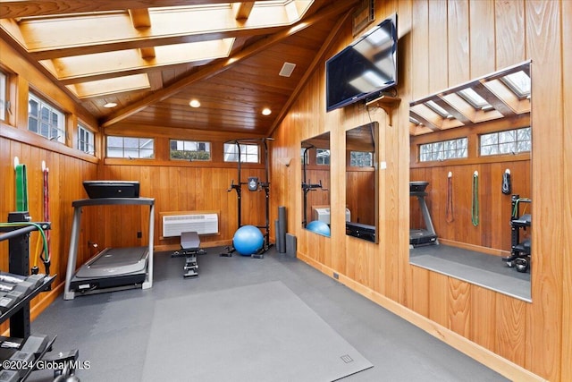 workout area with wooden walls and high vaulted ceiling