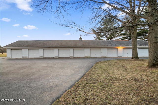 garage featuring a yard