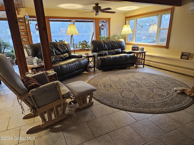 living room with a baseboard heating unit, a wall mounted AC, ceiling fan, and light tile flooring