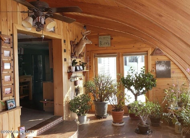 interior space featuring ceiling fan