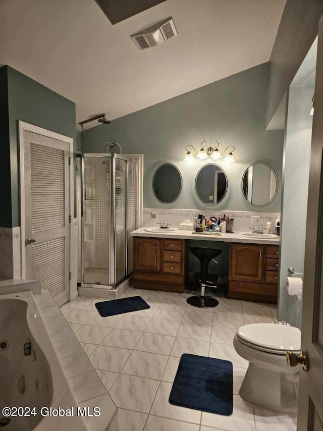 bathroom with toilet, double sink vanity, tile flooring, and a shower with door