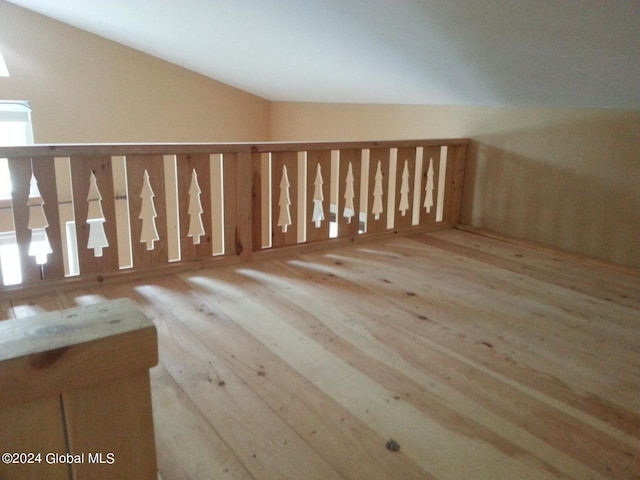 bonus room featuring light hardwood / wood-style floors and lofted ceiling