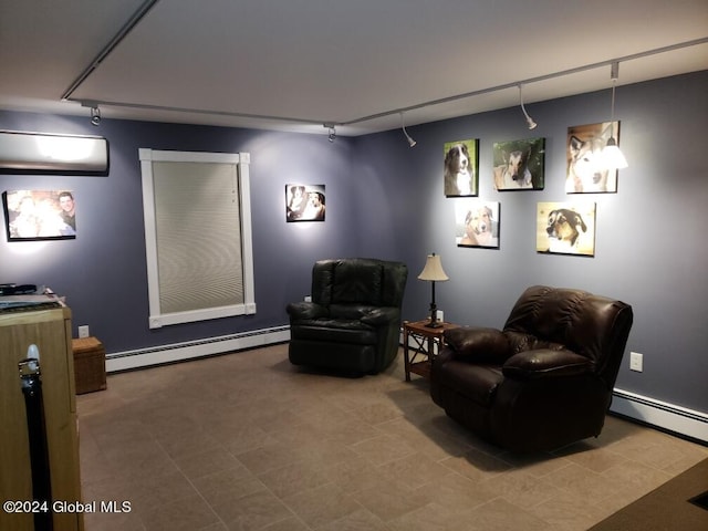 sitting room with track lighting, tile flooring, and a baseboard heating unit