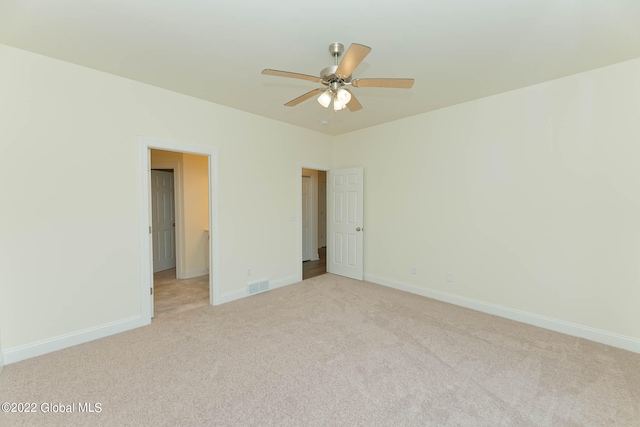 unfurnished bedroom with light carpet and ceiling fan