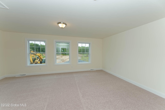 empty room featuring light colored carpet