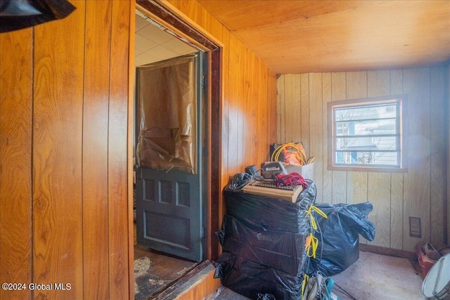 interior space featuring wood walls