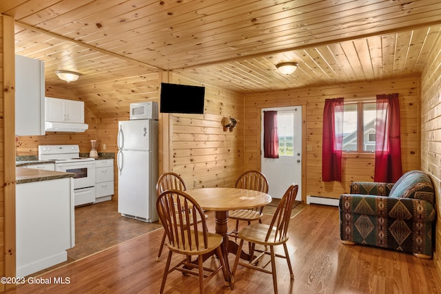 dining space featuring wooden ceiling, wood walls, and dark wood-type flooring