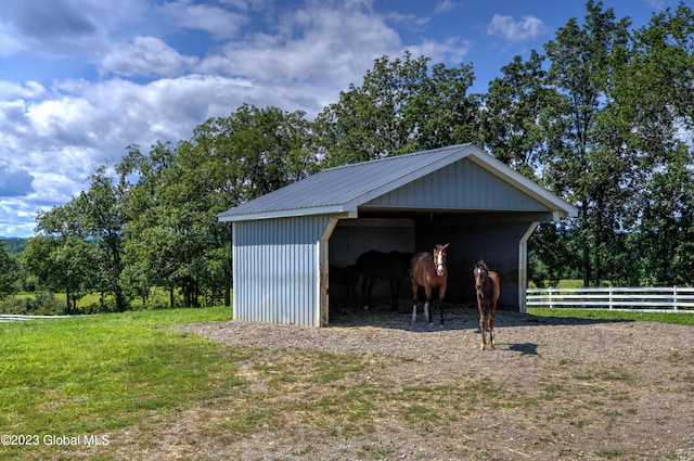 view of shed / structure featuring a lawn