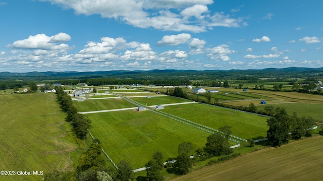 birds eye view of property with a mountain view and a rural view