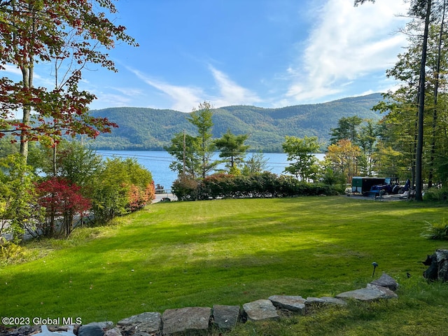 exterior space featuring a water and mountain view