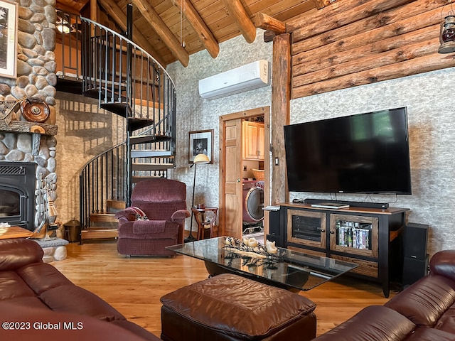 living room with beam ceiling, a fireplace, wooden ceiling, hardwood / wood-style floors, and a wall mounted air conditioner