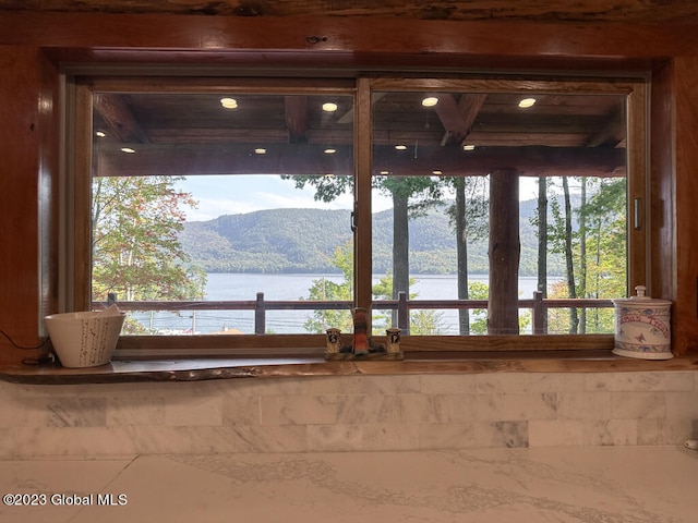 room details featuring a water and mountain view