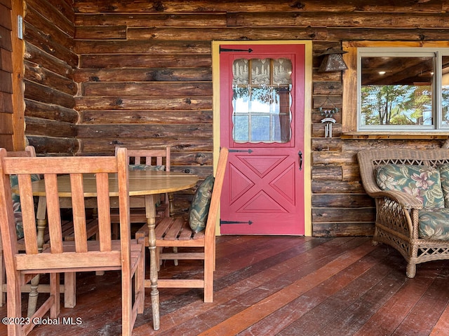 entrance to property with a wooden deck