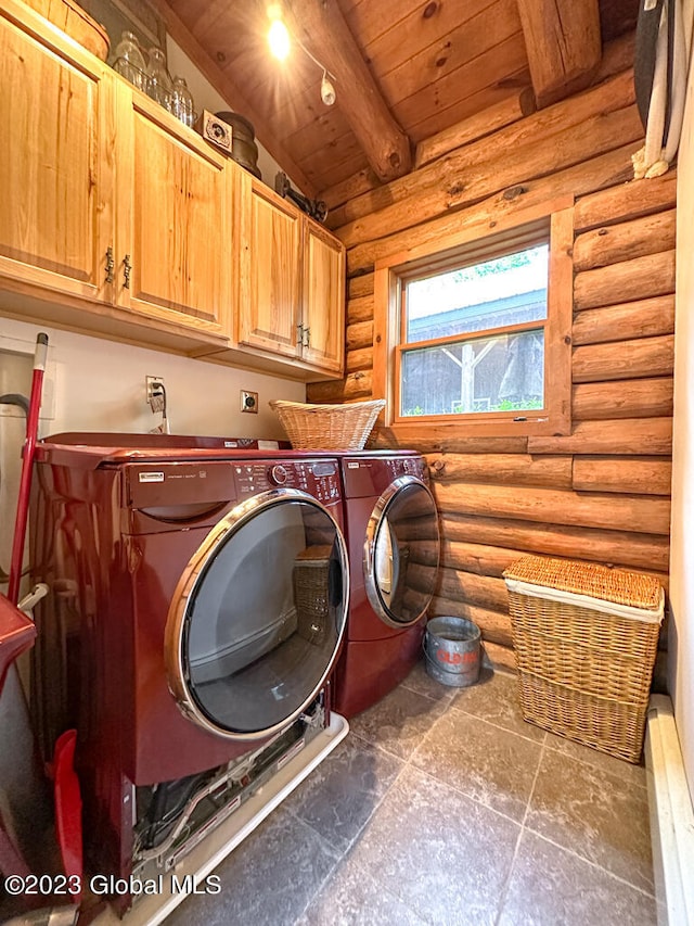 laundry area featuring log walls, wood ceiling, cabinets, and washing machine and dryer