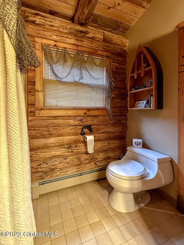 bathroom featuring tile floors, toilet, wooden ceiling, and a baseboard radiator