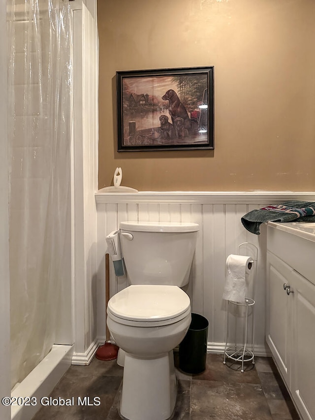 bathroom featuring toilet and vanity