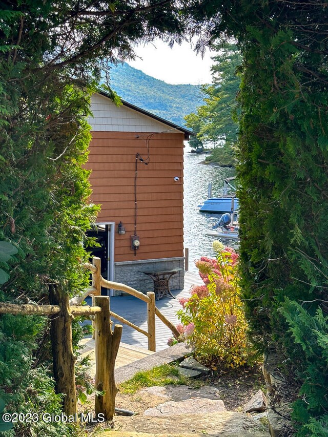 view of property exterior featuring a water view