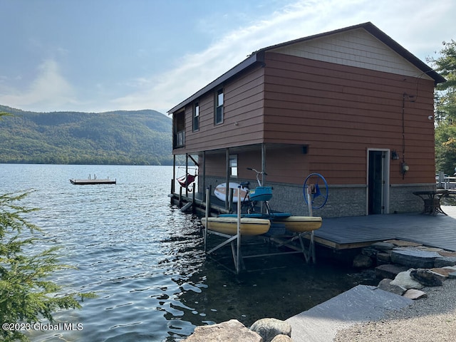 dock area with a water and mountain view