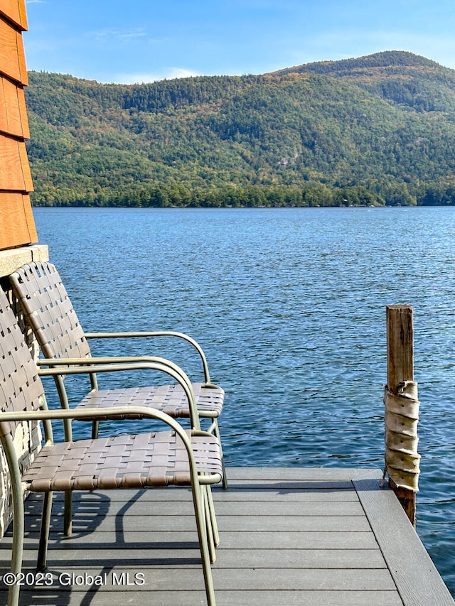 dock area featuring a water and mountain view