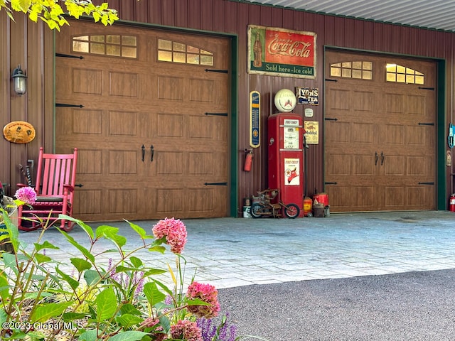 garage featuring wooden walls