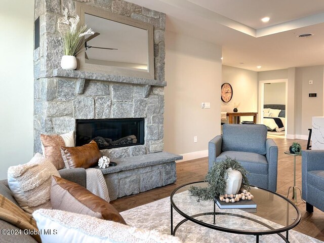 1 Kurosaka Ln Unit B, Lake George Village, NY 12845 - living room featuring a fireplace and hardwood / wood-style floors