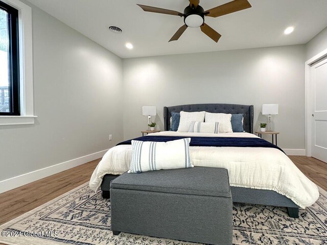1 Kurosaka Ln Unit B, Lake George Village, NY 12845 - bedroom featuring multiple windows, wood-type flooring, and ceiling fan