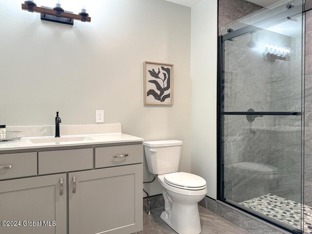 1 Kurosaka Ln Unit B, Lake George Village, NY 12845 - bathroom with toilet, tile patterned flooring, vanity, and walk in shower