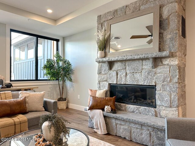 1 Kurosaka Ln Unit B, Lake George Village, NY 12845 - living room with a fireplace, light hardwood / wood-style floors, and ceiling fan