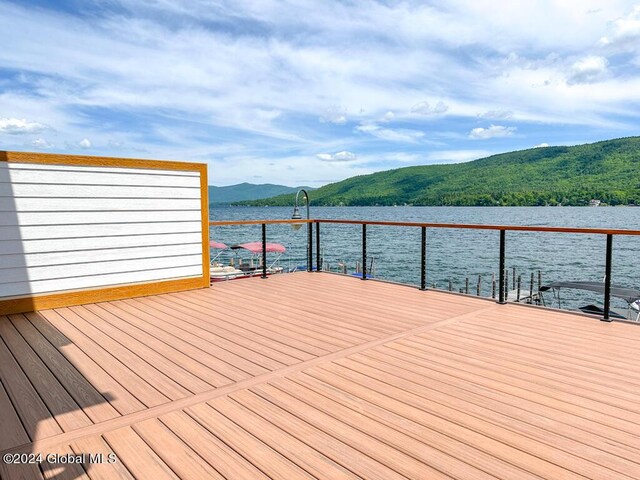 dock area with a water and mountain view