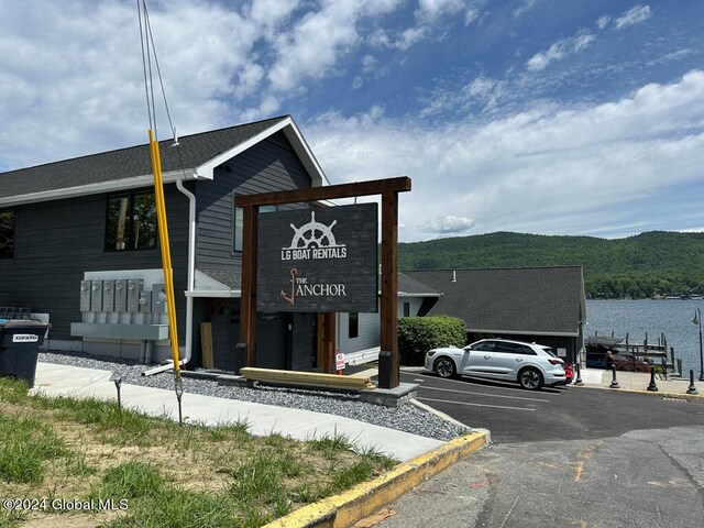 view of building exterior featuring a water and mountain view