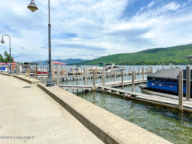 dock area featuring a water and mountain view