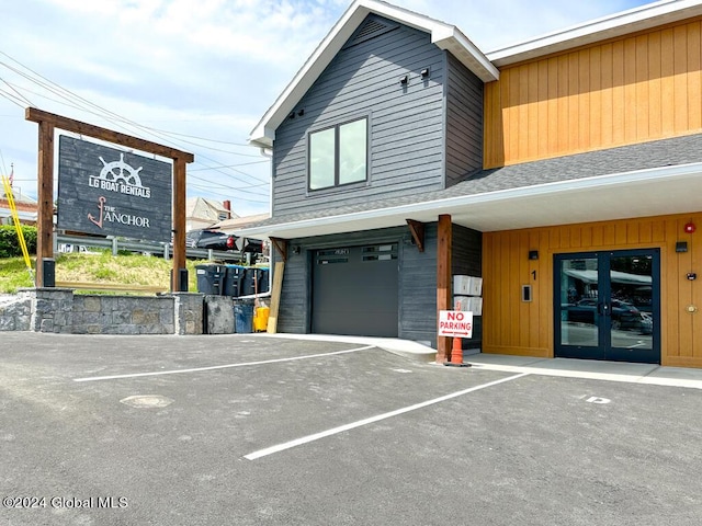 view of front of property with french doors and a garage