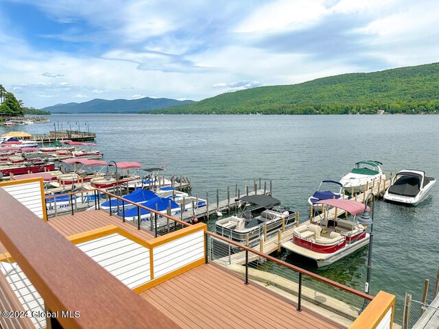 dock area with a water and mountain view