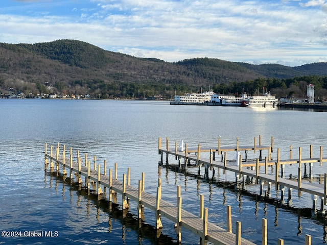 dock area featuring a water and mountain view