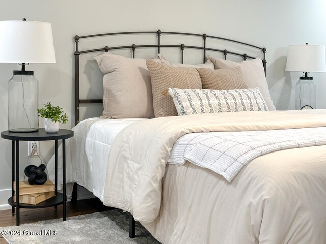 bedroom with wood-type flooring