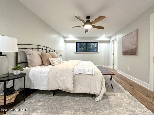 bedroom featuring ceiling fan and wood-type flooring