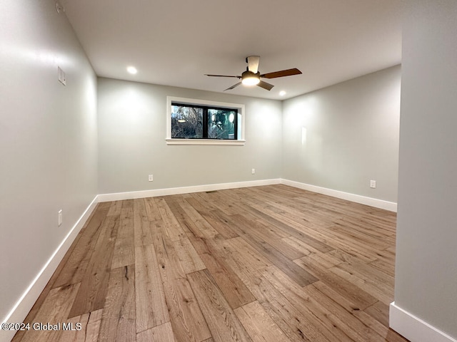 spare room featuring light wood-type flooring and ceiling fan