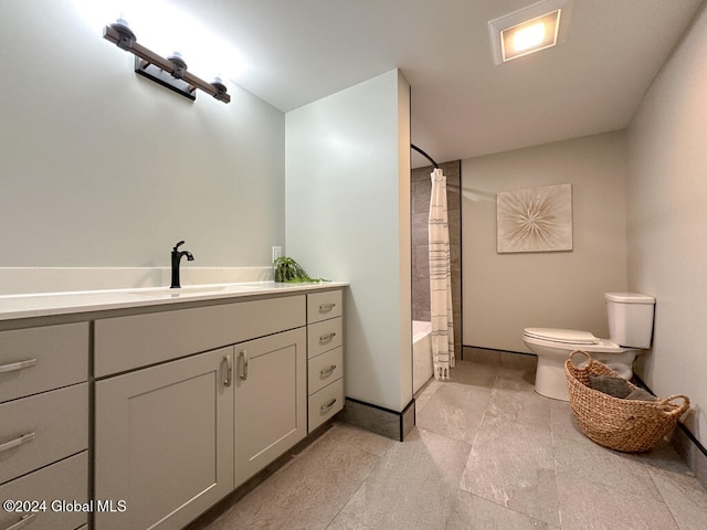 full bathroom featuring vanity, toilet, and shower / bathtub combination with curtain