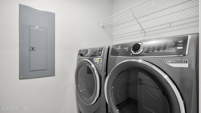 laundry room featuring independent washer and dryer and electric panel