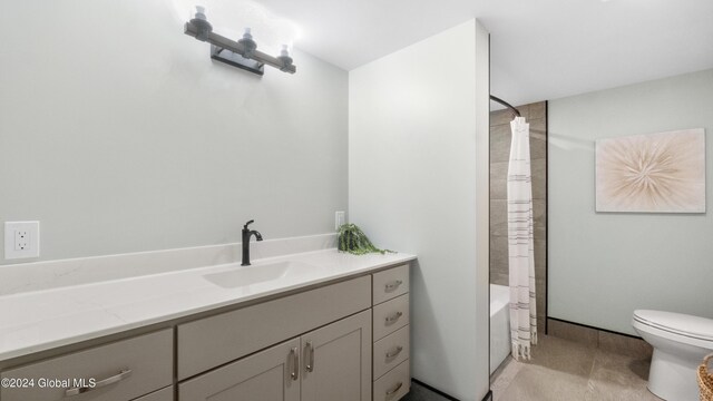 full bathroom with toilet, vanity, and shower / tub combo with curtain