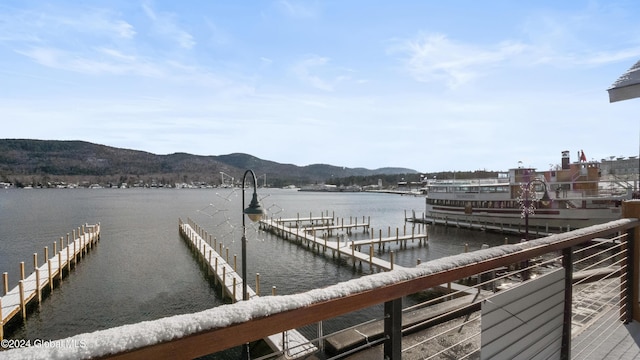 dock area with a water and mountain view