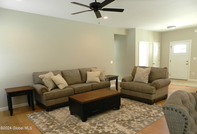 living room with ceiling fan and hardwood / wood-style floors