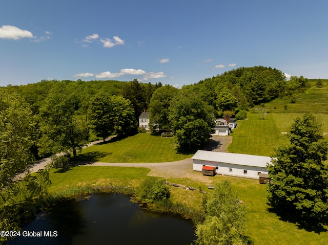 birds eye view of property with a water view