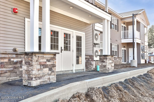 doorway to property featuring a balcony